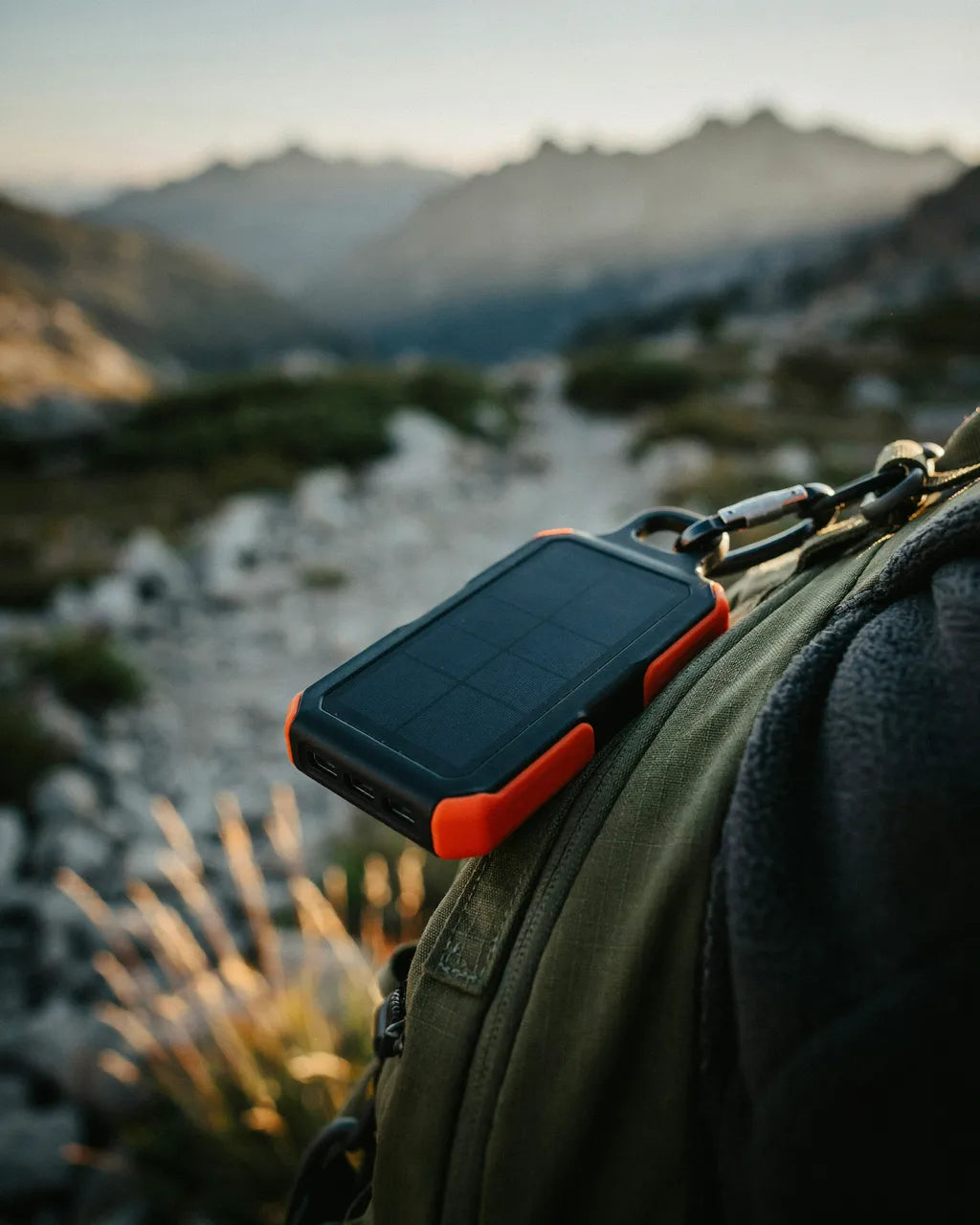 Ferro power bank clipped to a hiking backpack