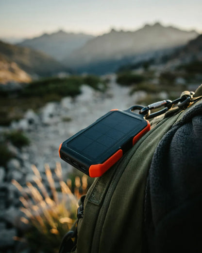 Ferro power bank clipped to a hiking backpack